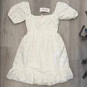 Never worn with tags. White summer dress.